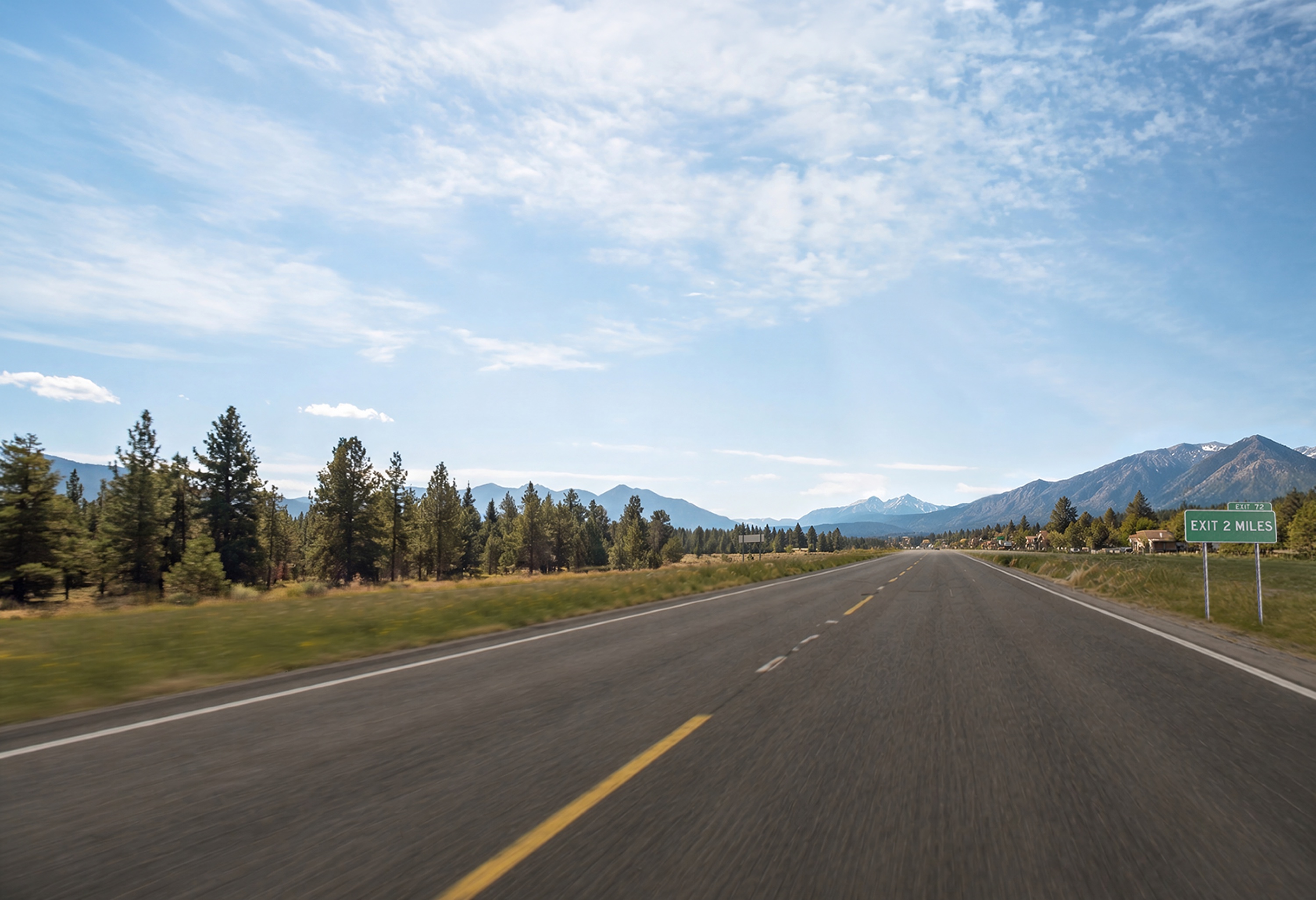 Mountain highway environment with exit sign