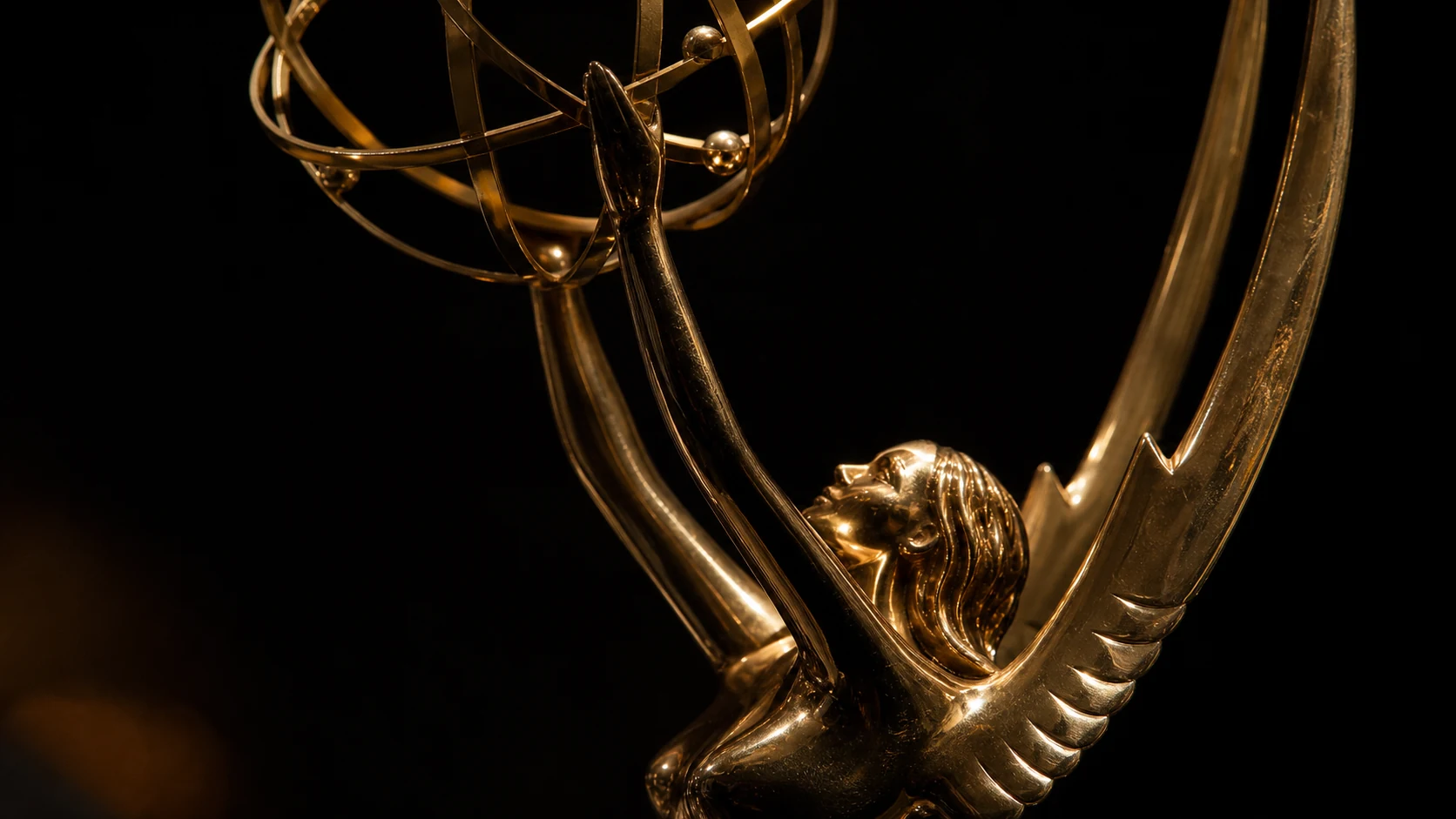 Close-up of a gold Emmy statuette